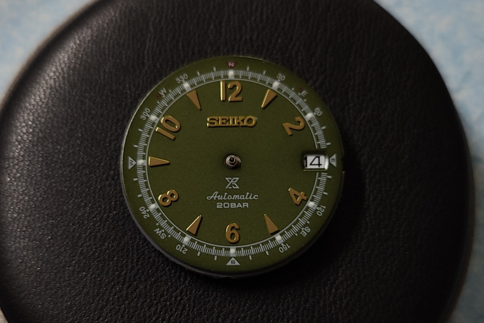 Test fitting the dial onto the movement